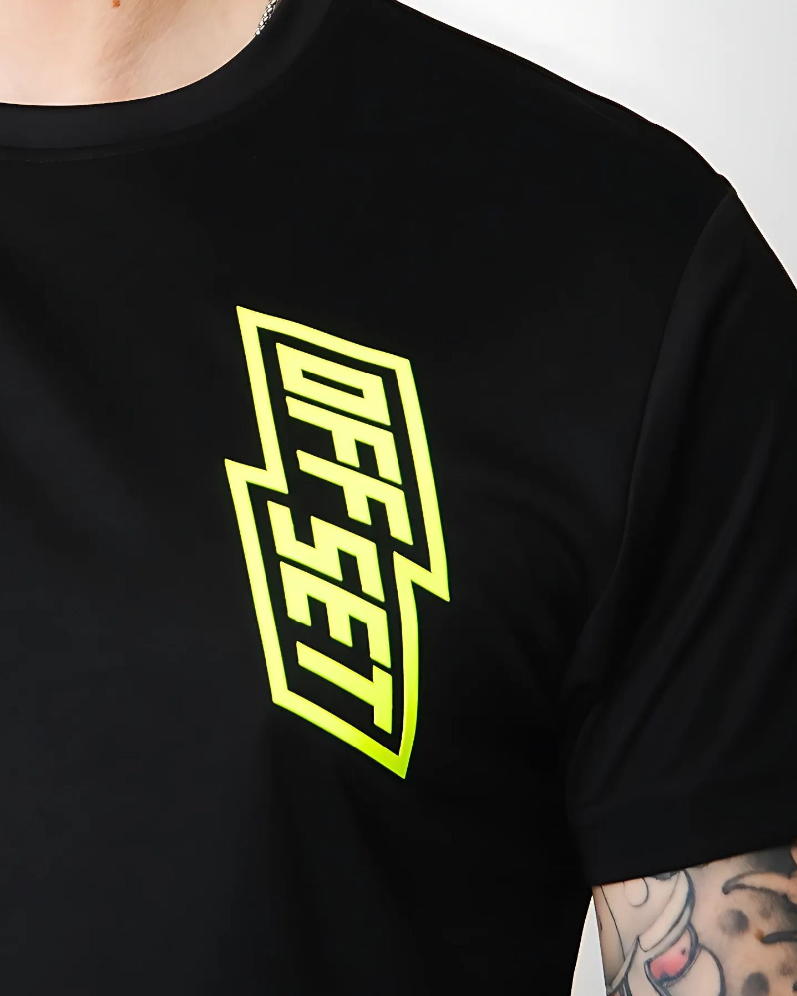 Close Up of OFFSET Sport T Shirt showing Fluro Yellow Logo on black 